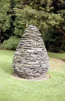 View of sculpture 'Cone', on grass beside Inverleith House.