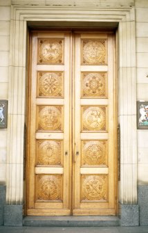 View of wooden doors carved with Scottish coins, at entrance to 42 St Andrew Square.