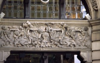 View of carved panel to right of entrance to The Scotsman Hotel, E side of building (North Bridge).