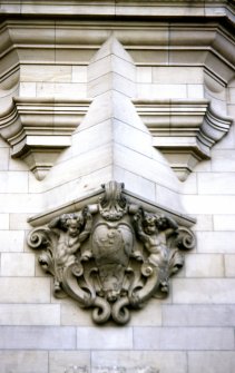 View of carved cartouche and putti, below corbel supporting first floor bay window of No.1 Market Street.
