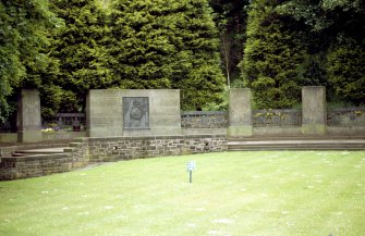 View of part of Royal Scots Memorial, showing main inscription plaque with regimental badge, and three carved monoliths.