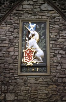 View of armorial panel of James V, on wall outside staff entrance.