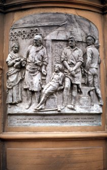 View of panel showing 'The Smiddy', on the right side of the pedestal of the Robert Burns statue.
