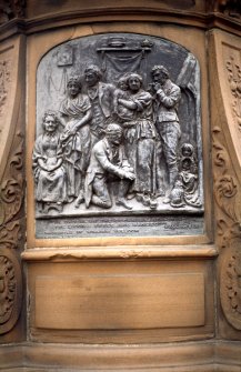 View of panel showing 'Hallowe'en', on the left side of the pedestal of the Robert Burns statue.