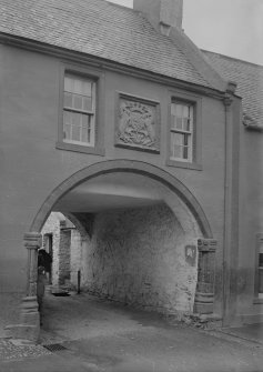 View of entrance and armorial panel.