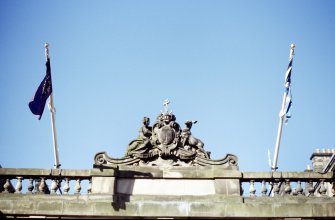 View of carved coat of arms of Edinburgh, above central arch of S screen of City Chambers (High Street).