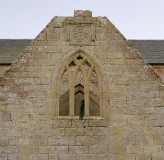 Fearn Abbey.  Ross aisle, view of traceried window and ross armorial, North gable.