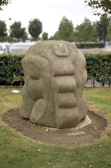 View of sculpture 'Figure in a Landscape', on grass between Gyle Shopping Centre and carpark, Gyle Avenue.