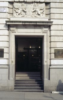 View of coat of arms on panel above door, 55 Hanover Street.