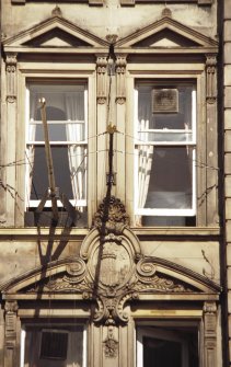 View of carved cartouche of Windsor Castle, above first floor windows of 100 Princes Street.