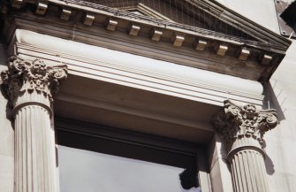 View of carved capitals (two of eight), flanking first floor windows of 142-144 Princes Street.