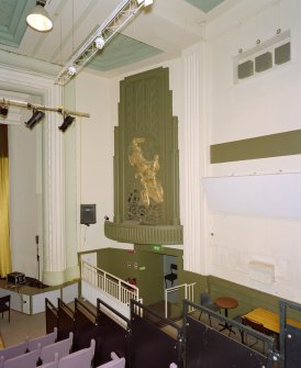 Interior. Main cinema (now theatre), view from W showing panel with charioteer relief