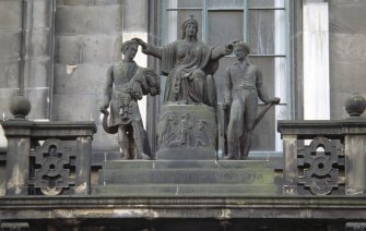 View of sculpture group representing 'Caledonia with her Children', on pierced parapet above S doorway to 3 George IV Bridge.