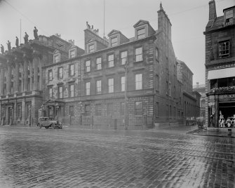 General view from West with car in front of building