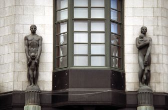 View of sculptures representing Insurance and Security, on top of columns either side of corner entrance to the Guardian royal Exchange, St Andrew Square, Edinburgh.