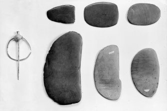 General view of flaying knives and Viking brooch.