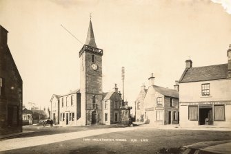 View of Town Hall, High Street, Kinross from NE with G Lowe & Son Butchers and Poulterers.
Titled: 'Town Hall & Fountain, Kinross. 13,101 G.W.W'.
