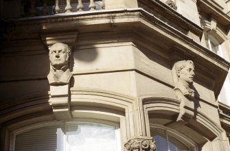 View of keystone heads, above ground floor bay window at E end of Crown Office (originally the Phrenological Museum).