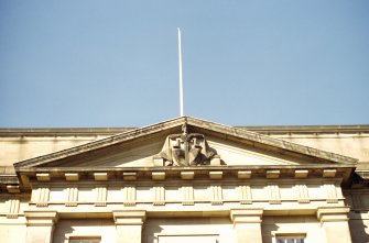 View of sculpture representing 'Justice', in pediment on High Street facade.