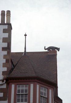 View of 'Cat' sculpture on top of central gable facing Princes Street.
