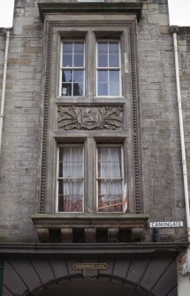 View of heraldic shield, above first floor windows above entry to Sugarhouse Close.