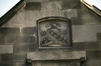 View of coat of arms in gable.