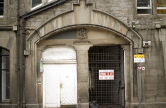 View of arched entrance to No.54 Bernard Street, showing coat of arms of Leith.