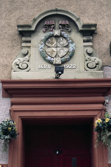 View of carved insignia of Masonic Lodge No.5, above door to No.56 Queen Charlotte Street.