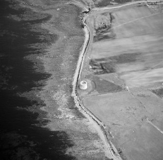 Hoy, Crockness, oblique aerial view, taken from the NNW, centred on the Martello Tower. A curving linear soilmark is visible in the centre right of the photograph.