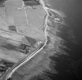 Hoy, Crockness, oblique aerial view, taken from the SE, centred on the Martello Tower. A curving linear soilmark is visible in the bottom left hand corner of the photograph.