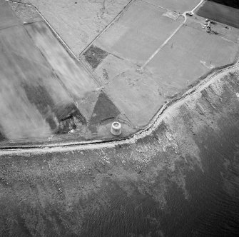 Hoy, Crockness, oblique aerial view, taken from the E, centred on the Martello Tower. A curving linear soilmark is visible in the top left hand corner of the photograph.