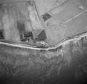 Hoy, Crockness, oblique aerial view, taken from the ENE, centred on the Martello Tower. A curving linear soilmark is visible in the top left hand corner of the photograph.