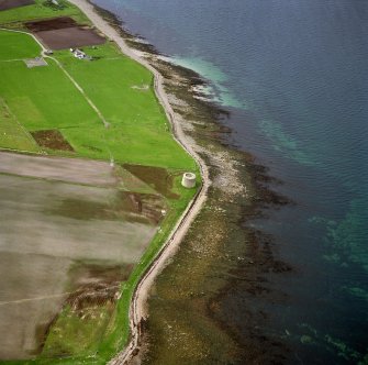 Hoy, Crockness, oblique aerial view, taken from the SE, centred on the Martello Tower. A curving linear soilmark is visible in the centre left of the photograph.