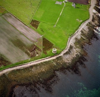 Hoy, Crockness, oblique aerial view, taken from the ESE, centred on the Martello Tower. A curving linear soilmark is visible in the centre left of the photograph.