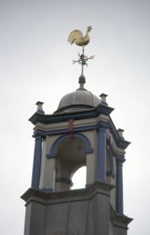 View of cockerel weather vane at top of tower.