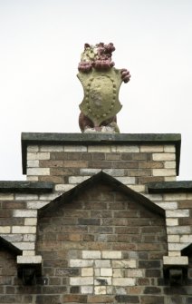 View of lion and shield, at apex of gable.