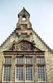View of carving of 'Education', in gable of Canongate facade.