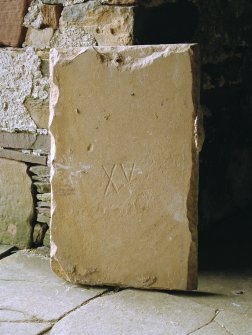 Detail of flagstone inscribed XV on base