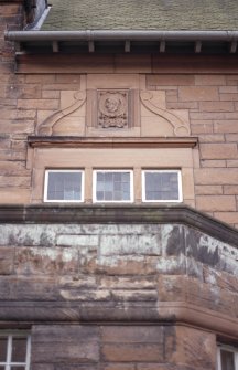 View of carved profile head, in medallion on facade of Scott House, 11 Kinnear Road.