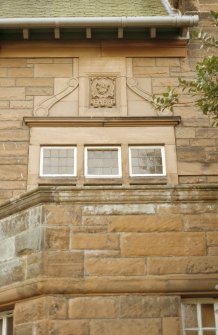 View of carved profile head, in medallion on facade of Jeffrey House, 13 Kinnear Road.