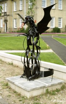 View of sculpture of a dragon, outside the sports' hall.
