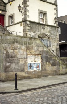 View of Tolbooth, showing drinking fountain on wall of steps, and arms of Queensferry and war memorial on lower part of tower.