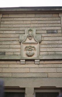 View of panel carved with Edinburgh arms, above doors of 13 and 14 St Leonard's Bank.
