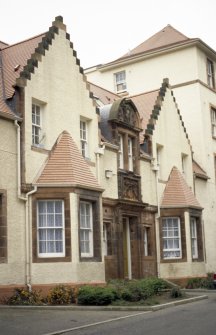 View of former Leith Hospital Nursing Home, showing coat of arms of Leith and Royal Arms of Scotland above entrance.