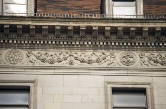 Detailed view of frieze above third floor windows of 112 Princes Street.