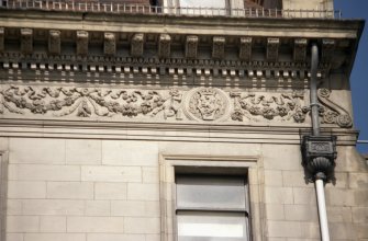Detailed view of frieze above third floor windows of 112 Princes Street.
