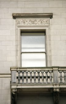 Detailed view of carving above window on second floor of 112 Princes Street.