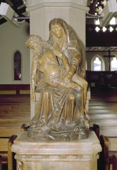 Interior. Detail of oak statue to 'Our Lady of Sorrows'