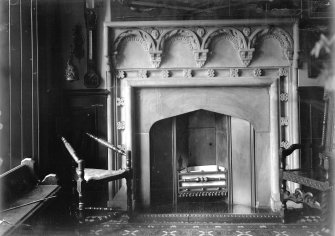 General view of fireplace in vestibule.