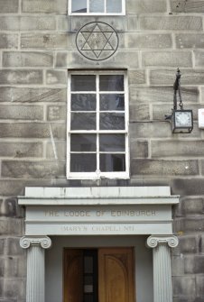 View of The Lodge of Edinburgh (Mary's Chapel) No.1, showing carved masonic symbol, lamp and bracket.